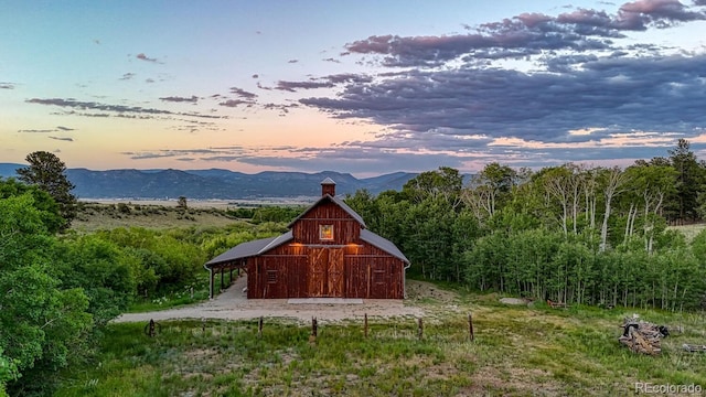 16202 County Road 327, Buena Vista, CO 81211 - outdoor structure at dusk with a barn and a mountain view