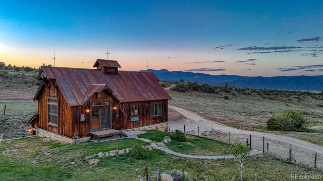 16202 County Road 327, Buena Vista, CO 81211 - view of front facade featuring a metal roof and a mountain view