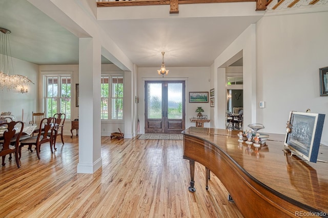 16202 County Road 327, Buena Vista, CO 81211 - entryway featuring a chandelier, french doors, and light wood-type flooring