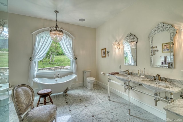 16202 County Road 327, Buena Vista, CO 81211 - bathroom featuring a chandelier, a soaking tub, and double vanity