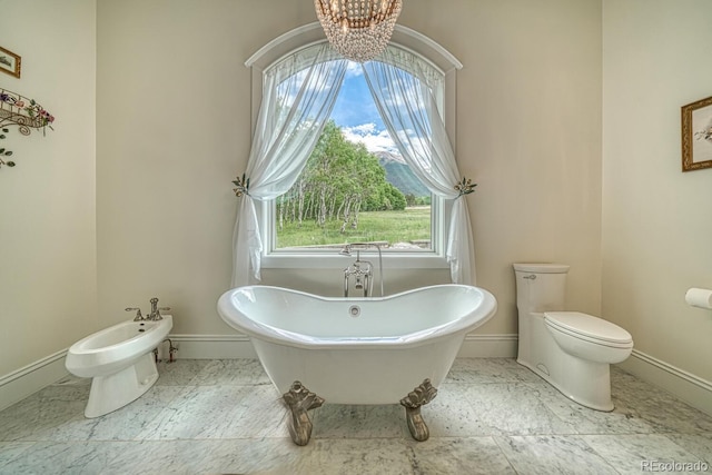 16202 County Road 327, Buena Vista, CO 81211 - bathroom with a soaking tub, a chandelier, and a bidet