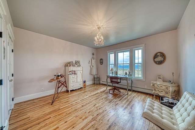 16202 County Road 327, Buena Vista, CO 81211 - living area featuring baseboard heating, a chandelier, and light wood-style floors