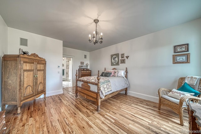 16202 County Road 327, Buena Vista, CO 81211 - bedroom with light wood finished floors and a chandelier