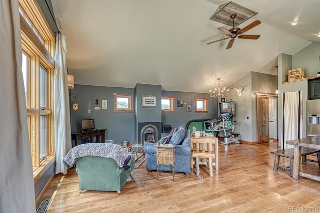 16202 County Road 327, Buena Vista, CO 81211 - living room with a ceiling fan, a chandelier, light wood-type flooring, and high vaulted ceiling
