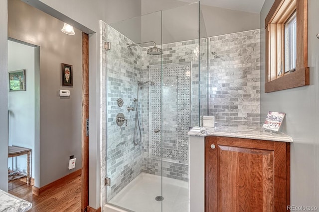 16202 County Road 327, Buena Vista, CO 81211 - bathroom featuring wood finished floors, a stall shower, and vaulted ceiling
