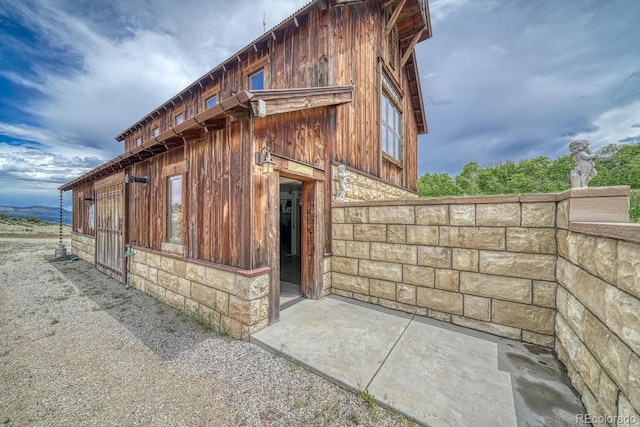 16202 County Road 327, Buena Vista, CO 81211 - view of side of home with stone siding and board and batten siding
