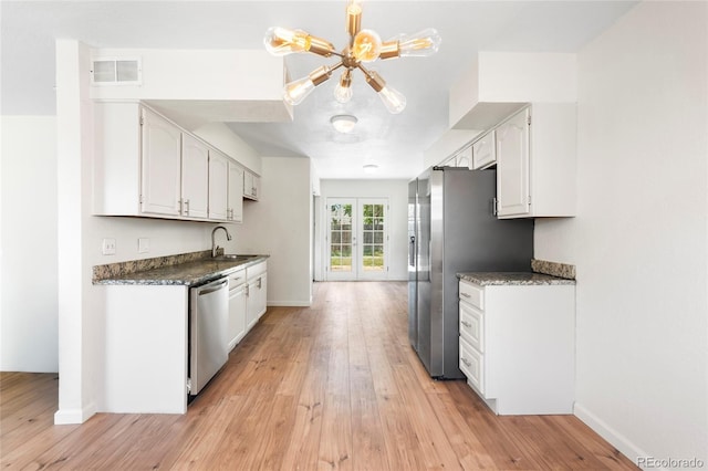 9320 Fir Dr, Thornton, CO 80229 - kitchen featuring appliances with stainless steel finishes, light wood-style floors, and white cabinets