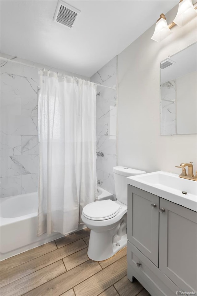 9320 Fir Dr, Thornton, CO 80229 - bathroom with vanity, shower / tub combo with curtain, and wood finished floors