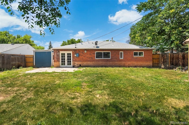 9320 Fir Dr, Thornton, CO 80229 - back of house with french doors, a fenced backyard, a patio area, and brick siding