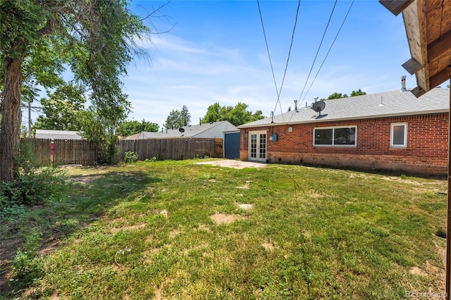 9320 Fir Dr, Thornton, CO 80229 - fenced backyard featuring french doors