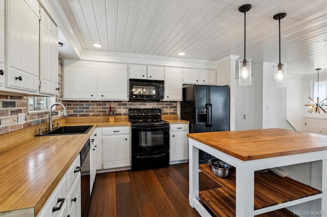 13472 W Dakota Ave, Lakewood, CO 80228 - kitchen featuring white cabinetry, tasteful backsplash, a sink, wood counters, and black appliances