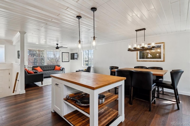 13472 W Dakota Ave, Lakewood, CO 80228 - dining space with ornamental molding, ceiling fan with notable chandelier, and dark wood-style floors