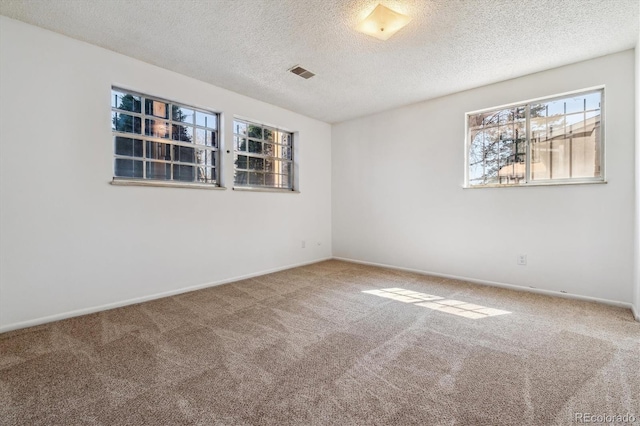 13472 W Dakota Ave, Lakewood, CO 80228 - empty room with carpet floors, a textured ceiling, and visible vents