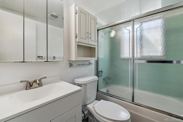 13472 W Dakota Ave, Lakewood, CO 80228 - full bathroom with vanity, toilet, shower / bath combination with glass door, and visible vents