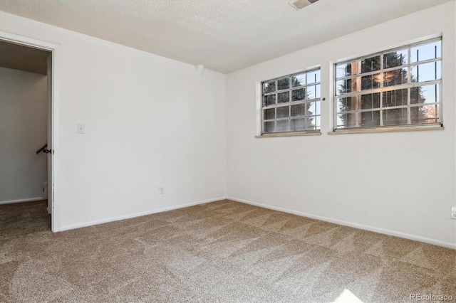 13472 W Dakota Ave, Lakewood, CO 80228 - unfurnished room featuring carpet floors, baseboards, and plenty of natural light