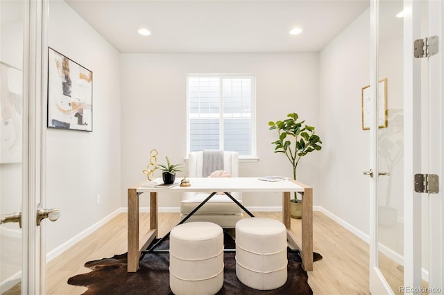 office area featuring light wood-style floors, recessed lighting, french doors, and baseboards