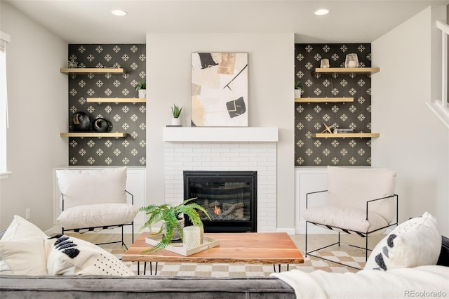 living area with a fireplace and recessed lighting