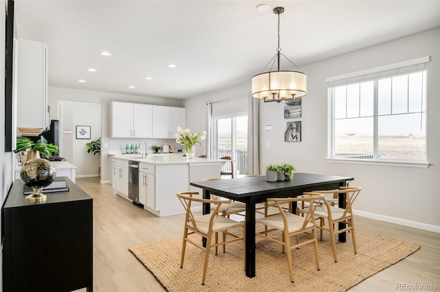 dining space with light wood finished floors, recessed lighting, and baseboards