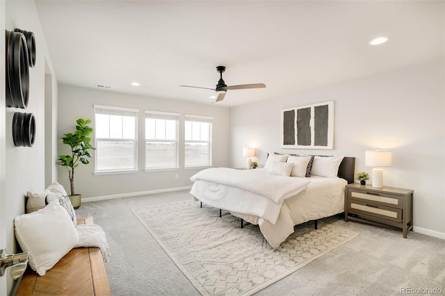 bedroom featuring recessed lighting, light carpet, and baseboards