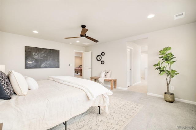 bedroom featuring recessed lighting, light colored carpet, visible vents, and baseboards