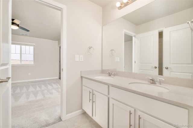 bathroom featuring double vanity, tile patterned flooring, a sink, and visible vents