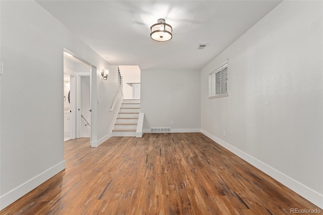 empty room featuring wood-type flooring