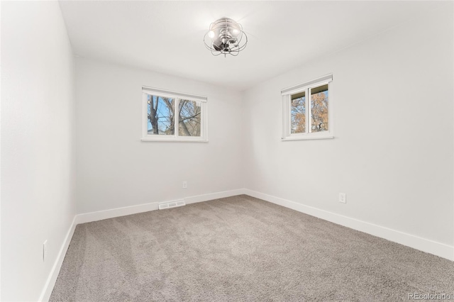 unfurnished room with carpet flooring