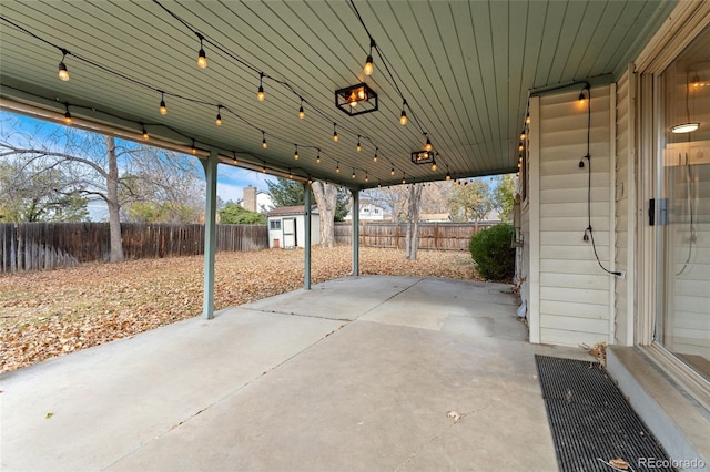 view of patio featuring a shed