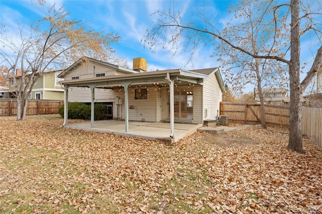 back of property featuring a patio