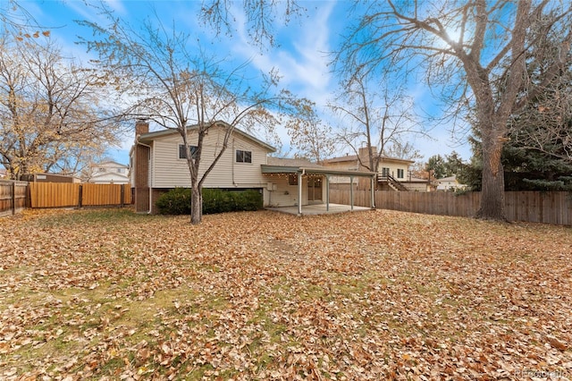 back of property with a patio