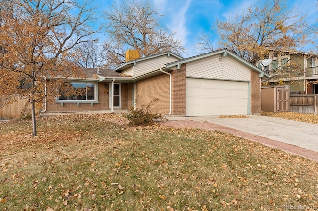 view of front of house with a garage and a front lawn