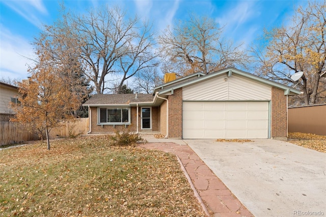 single story home with a front lawn and a garage