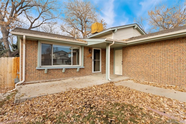 doorway to property featuring a patio area