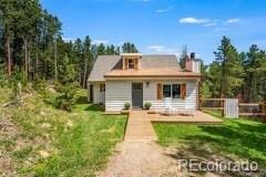 9092 Gray Ln, Conifer, CO 80433 - view of front facade featuring a chimney