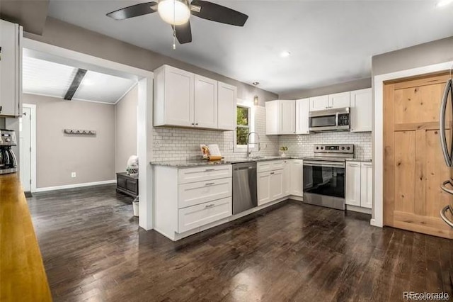 9092 Gray Ln, Conifer, CO 80433 - kitchen featuring stainless steel appliances, ceiling fan, tasteful backsplash, dark wood-type flooring, and recessed lighting