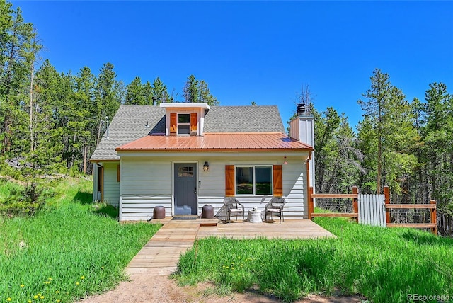 9092 Gray Ln, Conifer, CO 80433 - bungalow-style house featuring a chimney