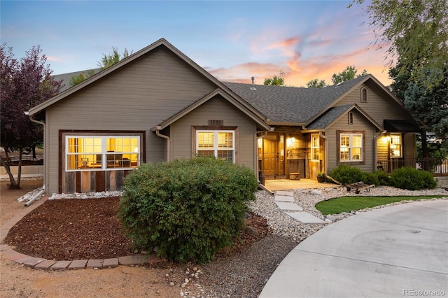 single story home with roof with shingles