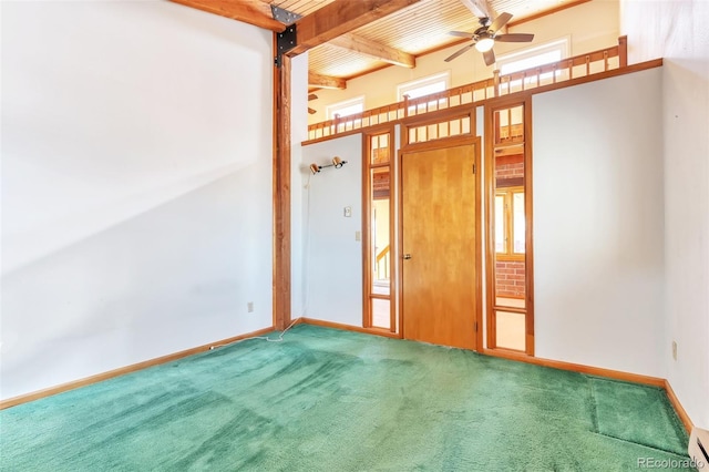 carpeted empty room with beam ceiling, a ceiling fan, a baseboard heating unit, wood ceiling, and baseboards