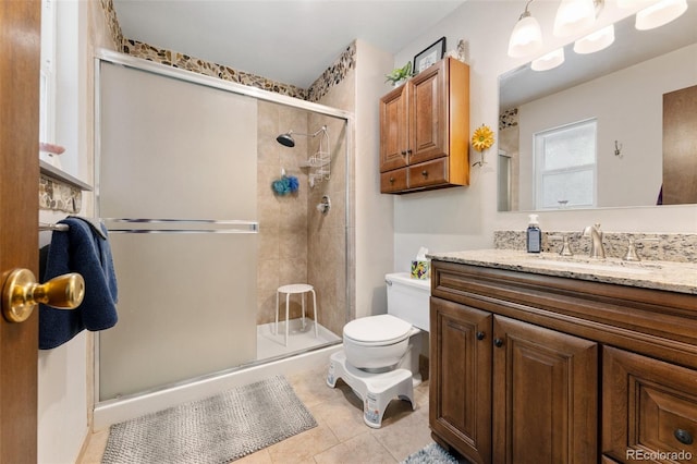 6170 Castlewood Ln, Colorado Springs, CO 80918 - bathroom with a stall shower, vanity, and tile patterned flooring