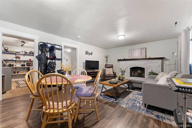 6170 Castlewood Ln, Colorado Springs, CO 80918 - living area with dark wood-style floors and a fireplace