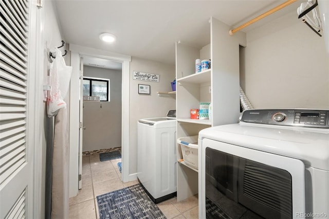6170 Castlewood Ln, Colorado Springs, CO 80918 - washroom featuring light tile patterned flooring and washer and clothes dryer
