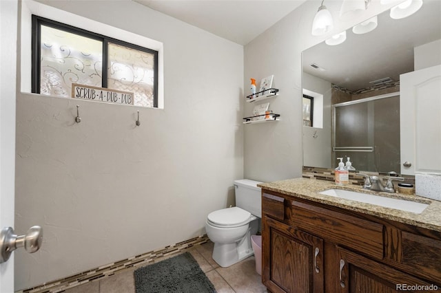 6170 Castlewood Ln, Colorado Springs, CO 80918 - bathroom featuring vanity, an enclosed shower, and tile patterned flooring