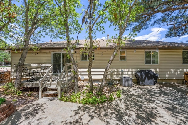 6170 Castlewood Ln, Colorado Springs, CO 80918 - back of property with a patio and a wooden deck
