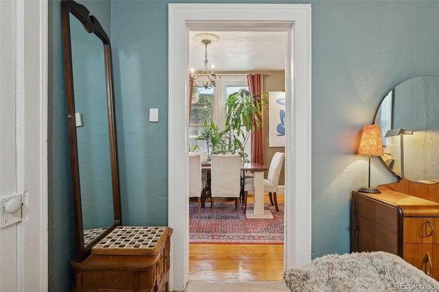 34 W Maple Ave, Denver, CO 80223 - hallway with a chandelier and wood finished floors