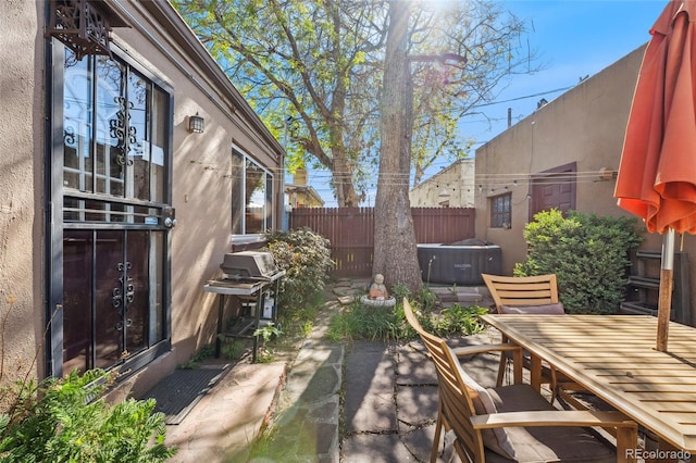 34 W Maple Ave, Denver, CO 80223 - view of patio / terrace with outdoor dining space, a jacuzzi, and grilling area