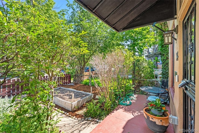 34 W Maple Ave, Denver, CO 80223 - view of patio with a vegetable garden