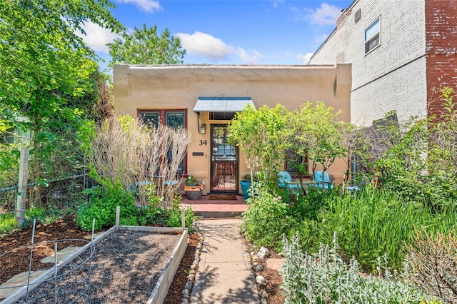 34 W Maple Ave, Denver, CO 80223 - view of exterior entry featuring stucco siding