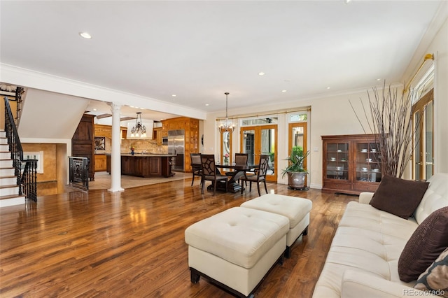 6901 E 12th Ave, Denver, CO 80220 - living room with plenty of natural light, ornate columns, stairs, recessed lighting, and a chandelier
