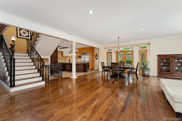 6901 E 12th Ave, Denver, CO 80220 - dining space with stairs, decorative columns, recessed lighting, wood finished floors, and ornamental molding