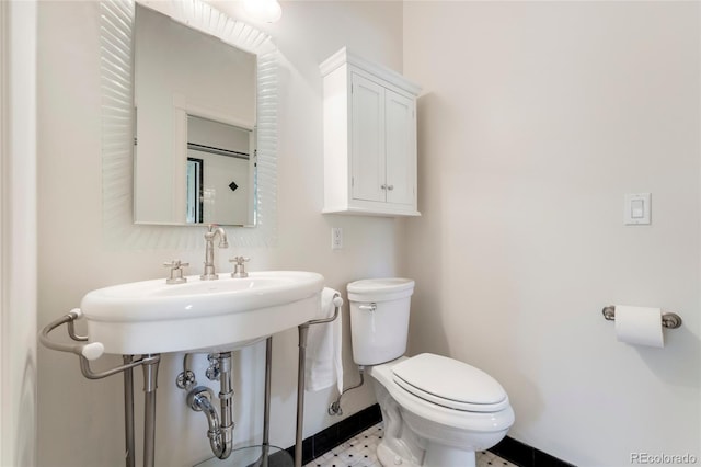6901 E 12th Ave, Denver, CO 80220 - half bathroom with toilet and baseboards